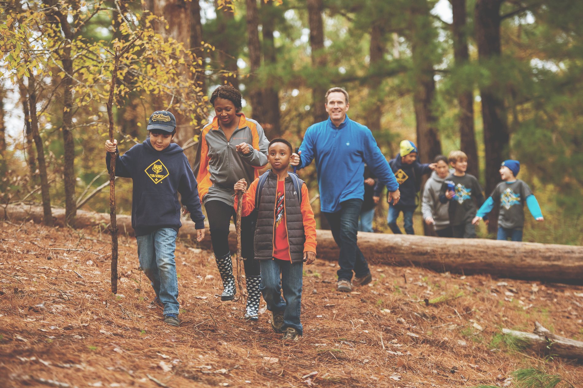 Cub Scouts exploring together on an outdoor trail