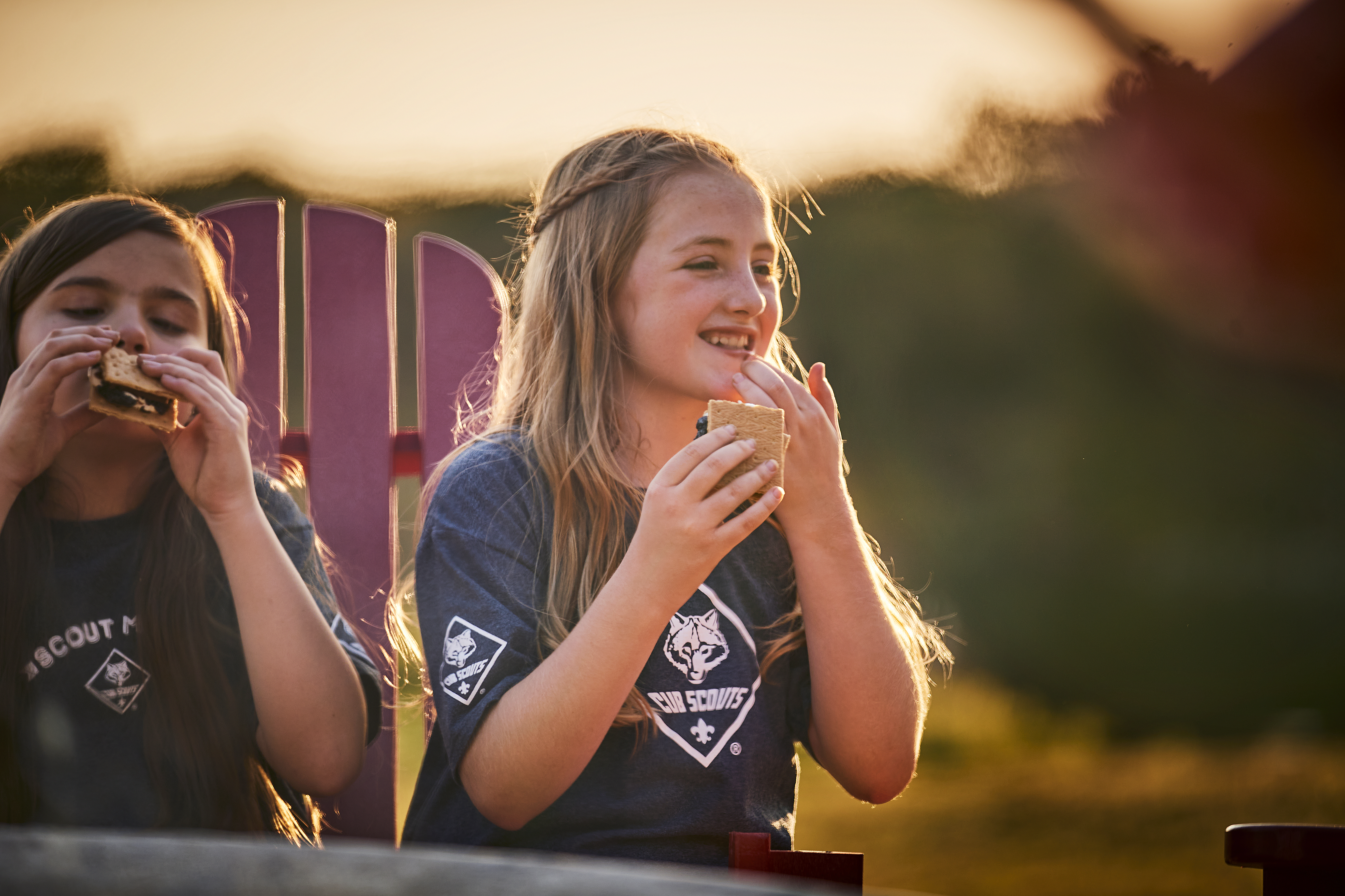 Cub Scouts enjoying campfire snacks together