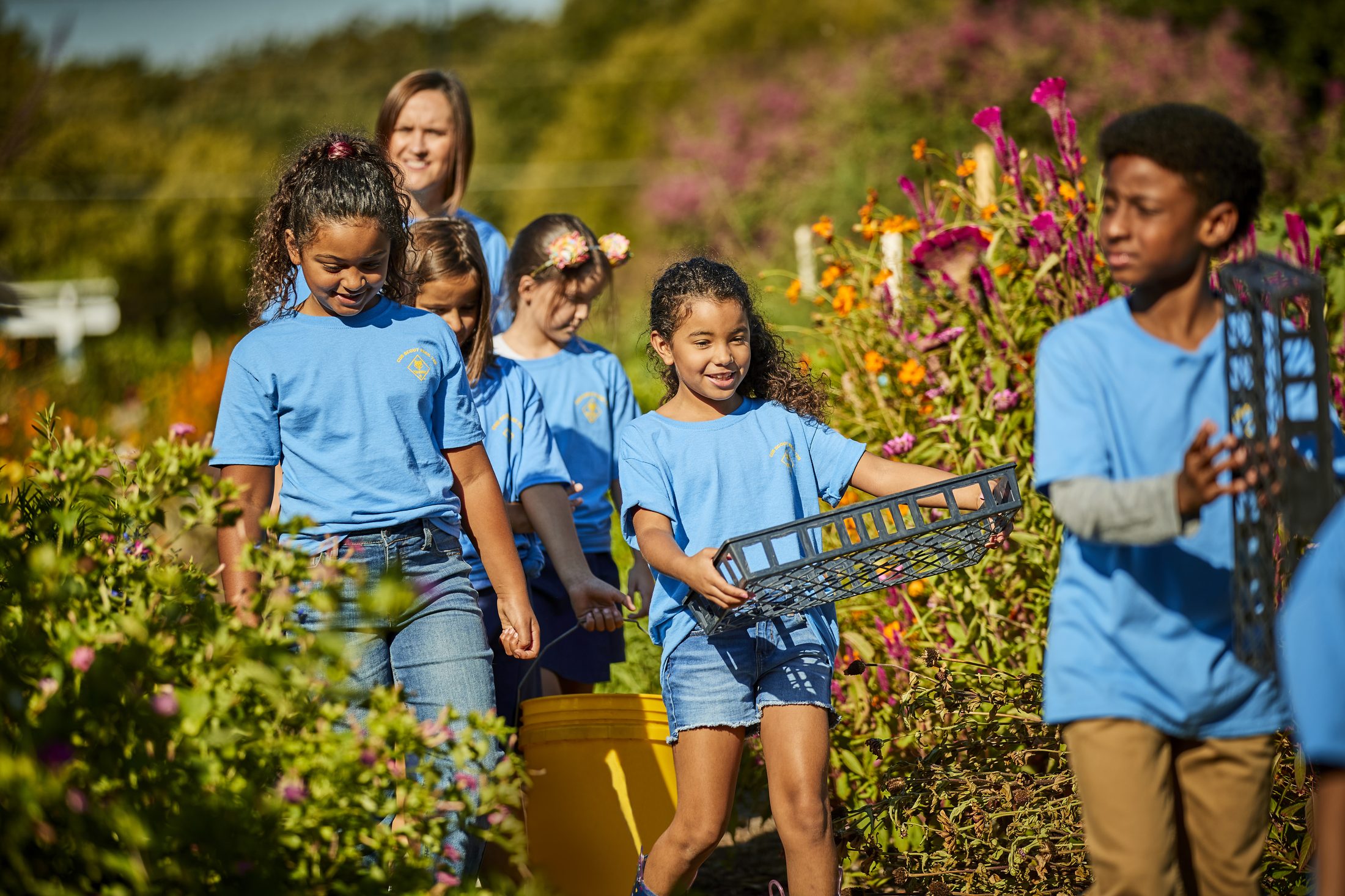 Cub Scouts working together in a community garden